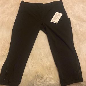 Lululemon, Black Tights swift speed HR crop 21” size 14